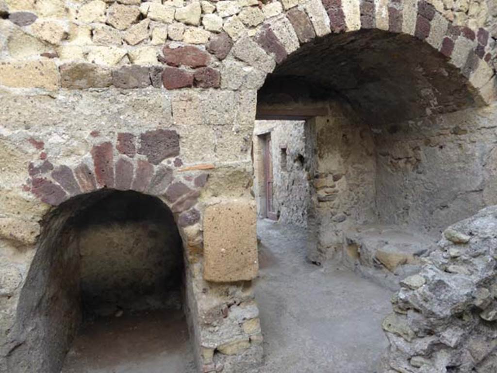 III.4 Herculaneum, October 2014. Looking towards north wall and two recesses under steps at III.5. Photo courtesy of Michael Binns.